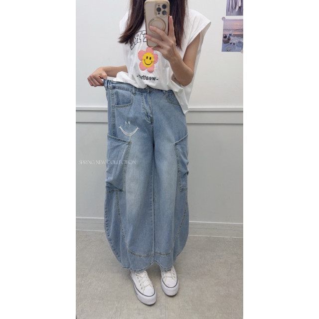 韓版超有型後鬆緊微笑刺繡工裝牛仔彎刀褲